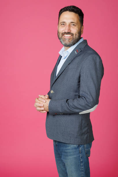 istock Dynamic Portrait handsome man.  Smart casual dressed  businessman,  Hot pink background. 2163552802