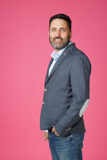 istock Dynamic Portrait handsome man.  Smart casual dressed  businessman,  Hot pink background. 2163552833