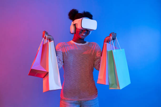istock Enjoy shopping young African wearing VR looking metaverse online. Contrivance. 2163553047