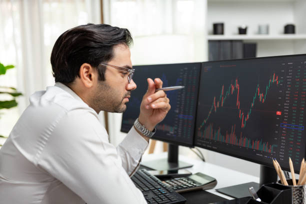 istock Trader analyzing in dynamic stock exchange investment screen on pc. Surmise. 2163553443