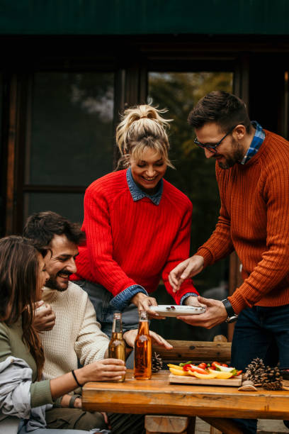 istock Friends and family eating 2163554059