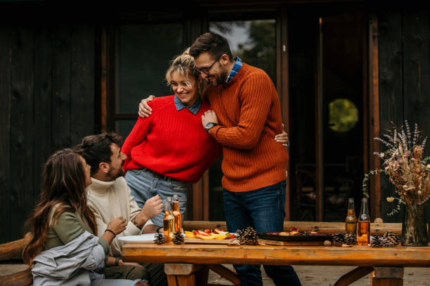 istock Friends and family eating 2163554069