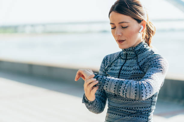 istock Sporty woman using smartwatch 2163555853