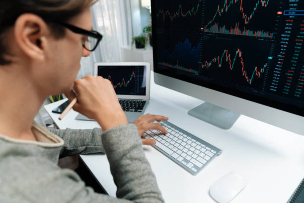 istock Business trader using computer and laptop to search high profit. Pecuniary. 2163561165