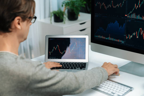 istock Business trader using computer and laptop to search high profit. Pecuniary. 2163561842