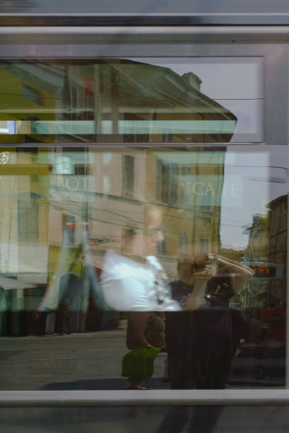 Shot of a beautiful young woman posing behind a glass surface