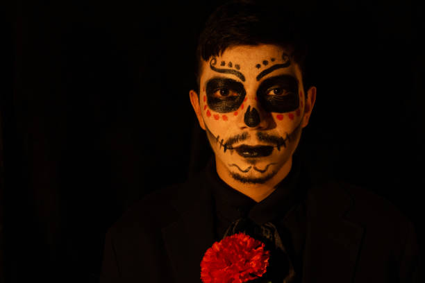 istock man with catrin makeup with a red flower 2163568152
