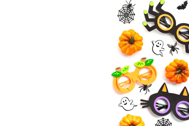 istock Festive Halloween decor elements isolated on white backdrop. Perfect for seasonal design projects or holiday-themed content. Includes spooky glasses, pumpkins, spider webs, and ghosts 2163568585