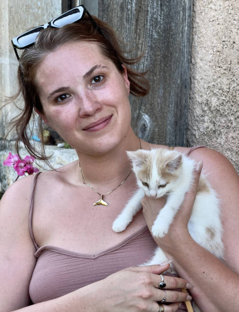 istock IMG_8390 Beautiful woman with a tiny kitten 2163568717