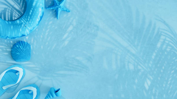 Summer beach holiday travel background with palm tree shadows on blue background. Digitally generated image. 3d render.