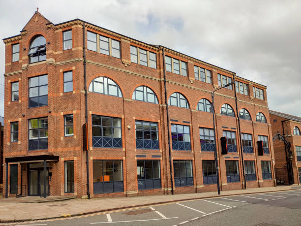 istock Historical buildings by river aire Leeds England UK 2163570781
