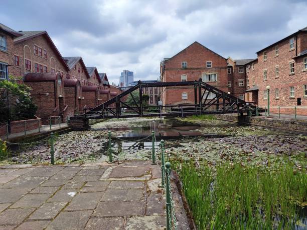 Historical buildings by river aire Leeds England UK