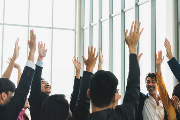 istock Successful business people raised their hands up for voting. Intellectual. 2163571722