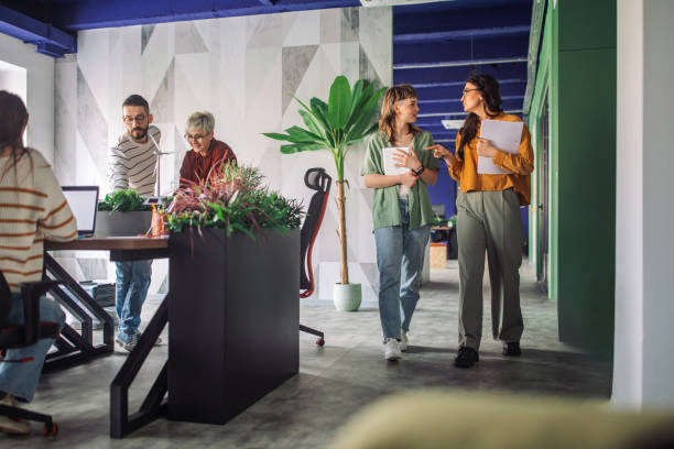 istock Modern office setup with employees in casual attire 2163571748