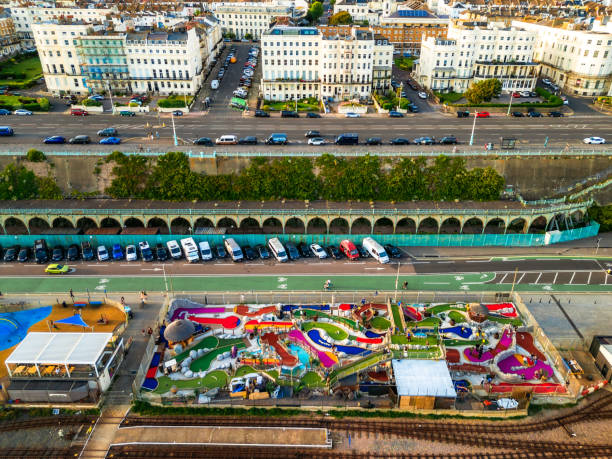 Brighton, UK - 18 July, 2024: Aerial view, taken by drone, depicting a colorful crazy golf course at the beach in Brighton, UK.