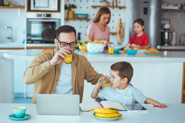 istock Caucasian Father and Son Spending Time Together with Laptop 2163573867