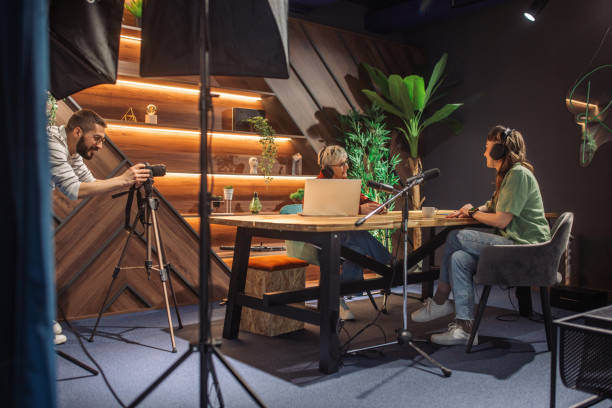 istock Podcast session with two hosts and a filming crew 2163574914