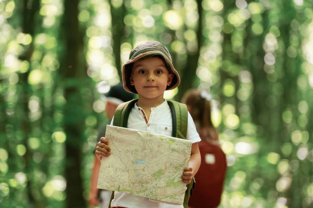 istock Kids in forest at summer daytime together 2163576569