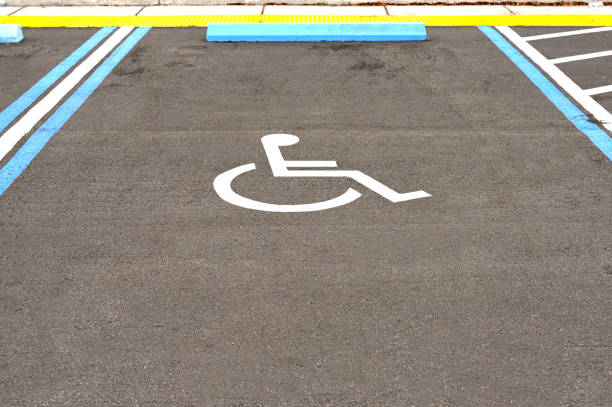 istock Car parking bay for disabled people 2163577000