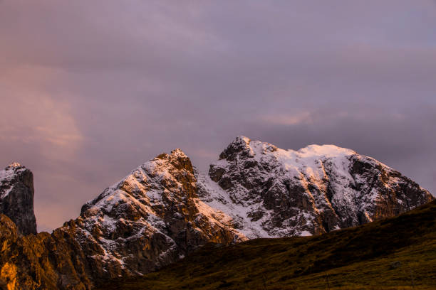 Sunset over snowy mountains.