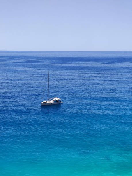 istock a beautiful ship is sailing in the blue sea 2163578104