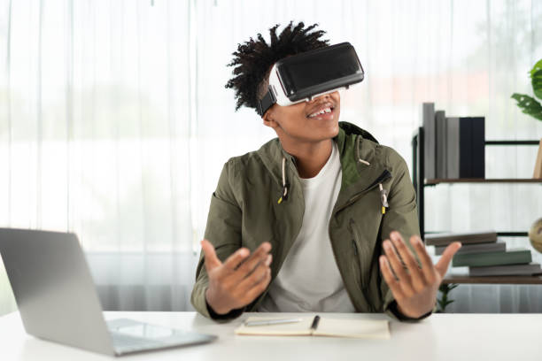 istock Young African American studying through VR glasses online course. Contrivance. 2163579115