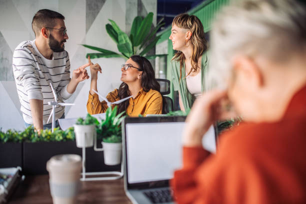 istock Team members conversing and brainstorming in modern office 2163580352