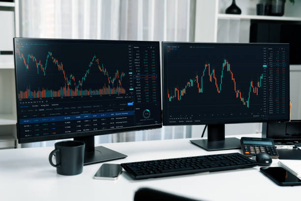 istock Two screens of dynamic stock market exchange graph showing computer. Infobahn. 2163580511