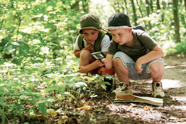 istock Kids in forest at summer daytime together 2163581659