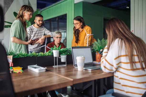 istock Teamwork around a laptop in a modern office space 2163582486