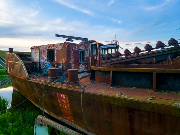 Rusty old ships in the harbor of Tisza near Szeged in summer