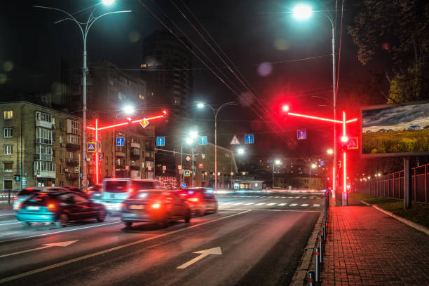 istock Red light on modern traffic light semaphore in night city 2163584952