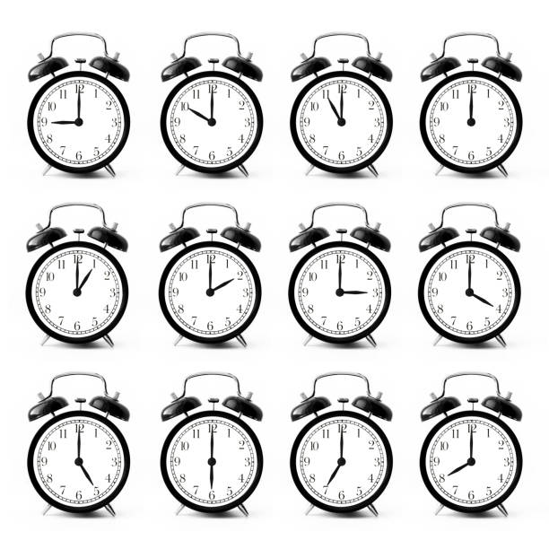 istock Set of a black alarm clocks with a different time isolated on a white background 2163585017