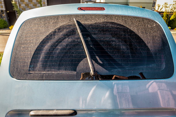 istock Dirty rear back car window and windshield wiper blade 2163585046