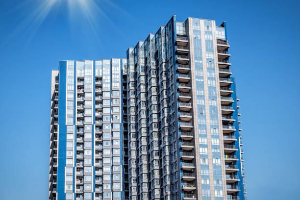 istock Blue modern tower buildings or skyscrapers on blue sky background 2163585357