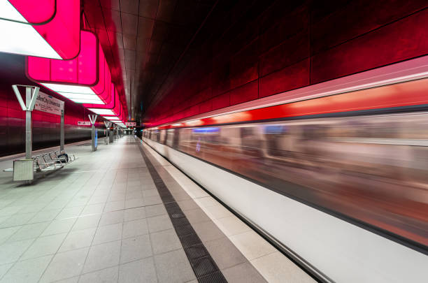 Germany, Hamburg, Hafencity, June 08, 2023 -Blurred motion of a arriving subway train at subway station