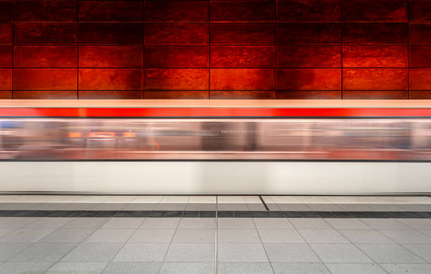 Germany, Hamburg, Hafencity, August 17, 2023  -Blurred motion of a arriving subway train at subway station