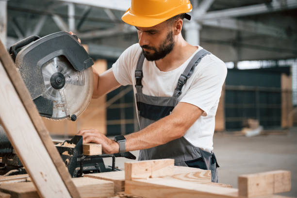 istock Side view, cutting the wood. Industrial worker in the warehouse 2163586790