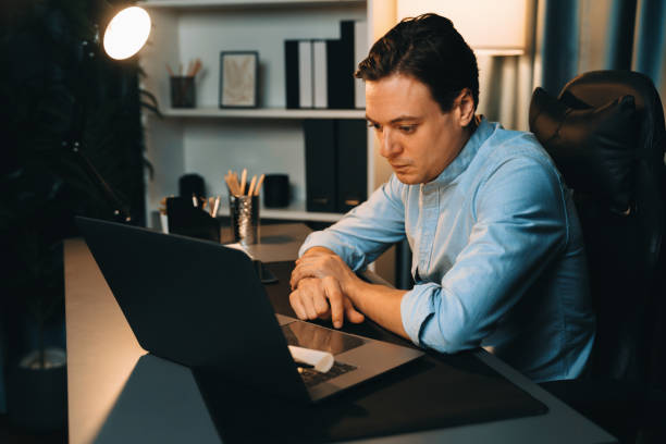 istock Businessman working on laptop for searching database market stock. Pecuniary. 2163589977