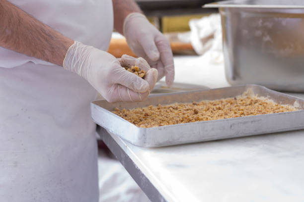 istock The pastry chef is making walnut baklava. 2163593703