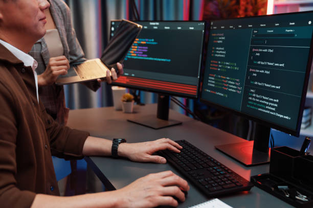 istock IT developers discussing intelligent website with laptop showing data. Infobahn. 2163594901