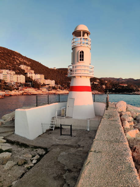 istock beautiful lighthouse tower on the coast at sunset 2163595891