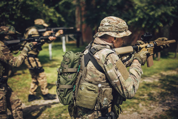 istock Soldier with backup advancing during tactical mission 2163596116