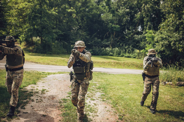istock Soldiers aiming their weapons during military training 2163596264