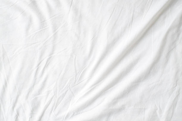 istock Abstract White Bedding Sheets or White wrinkled fabric background texture and Texture with copy-space :Creased or wrinkled white fabric,Soft focus 2163599206