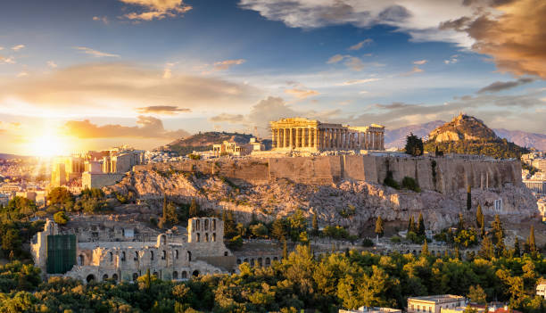 buildings against sky during sunset - acropoli atene immagine foto e immagini stock