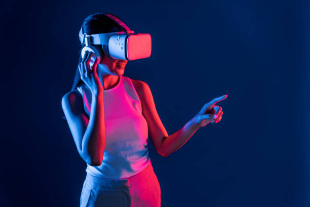 istock Elegant female connect metaverse use finger point virtual object. Hallucination. 2163601004