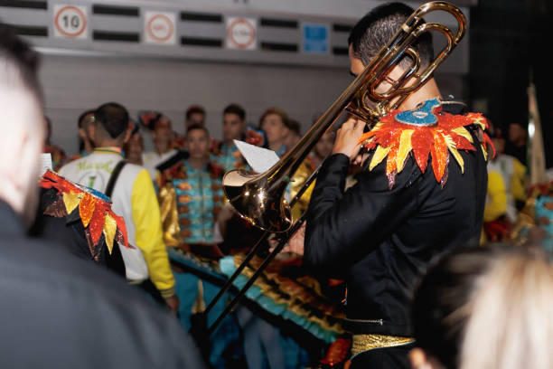 Lisbon, Portugal - June 12, 2019: A trumpet musician dressed in a traditonal folklore costume, plays before parading in Lisbon downtown, during this city celebrations of the Popular Saints.