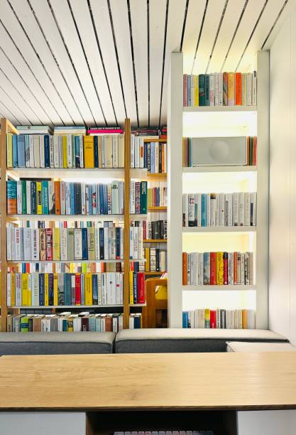 istock Desk in a library, bookshelves in the background 2163606620