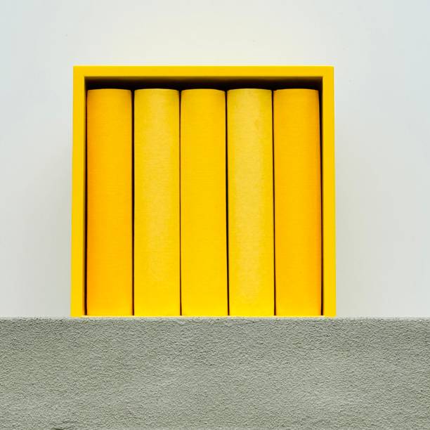 Yellow generic books in a yellow square shelf